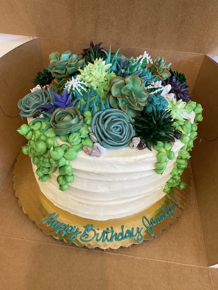 IMG_0802 Custom birthday cake decorated with flowers on top